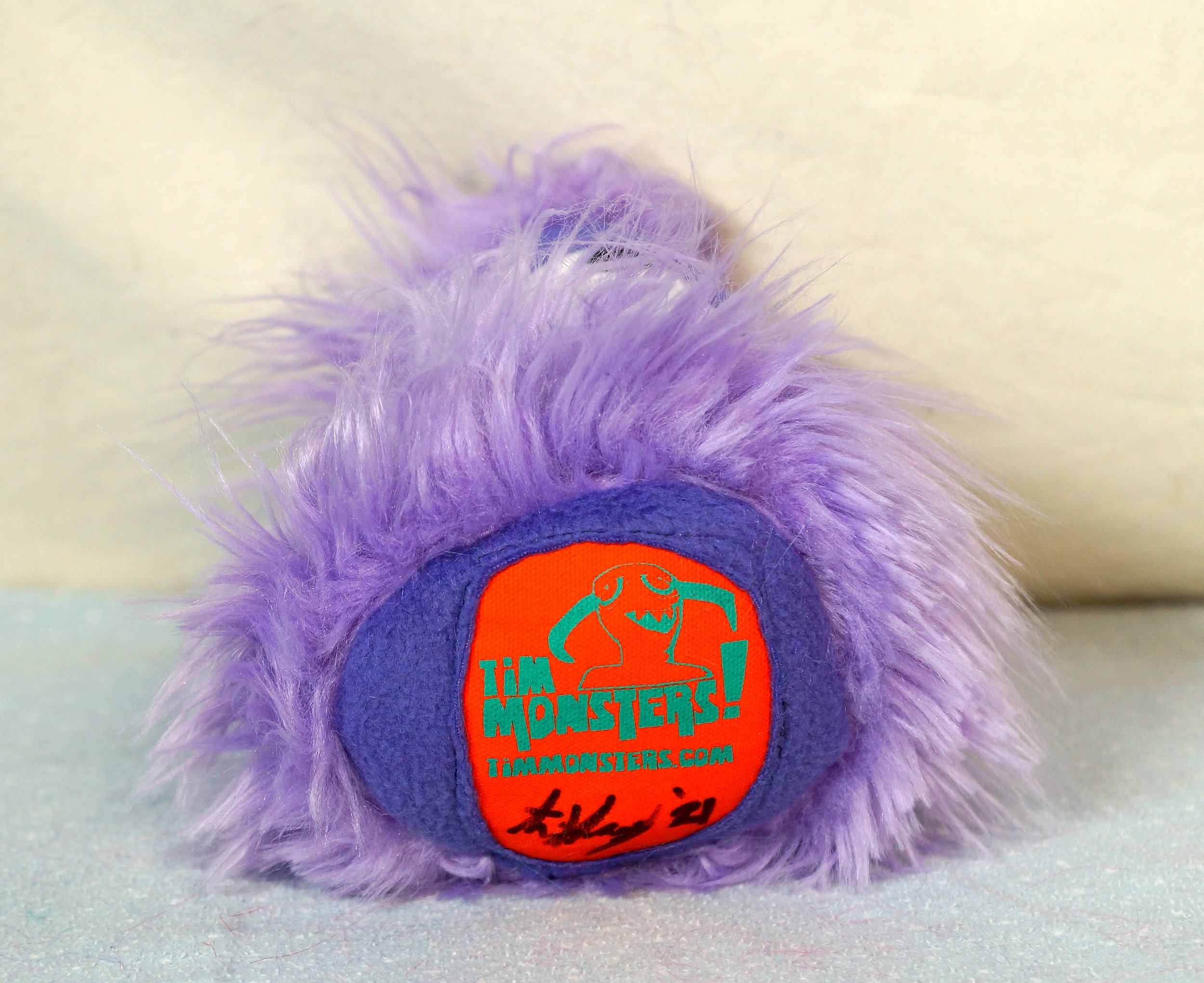 SMALL LIGHT PURPLE MONSTER WITH ONE SLEEPY EYE, MOUTH — TIM